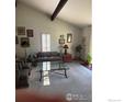 Inviting living room with neutral tones, large windows, and comfortable seating arrangements at 5435 Tenino Ave, Boulder, CO 80303