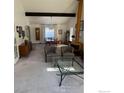 Bright and airy living room with high ceilings, fireplace, and ample natural light at 5435 Tenino Ave, Boulder, CO 80303