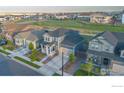 Charming two-story home with a well-maintained front yard in a desirable neighborhood at 5782 Slate River Pl, Brighton, CO 80601
