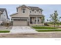 Charming two-story home featuring a two-car garage and a welcoming front porch at 5901 Aspenglow St, Longmont, CO 80504