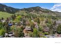 Stunning aerial view of a neighborhood nestled against the backdrop of scenic mountains at 721 9Th St, Boulder, CO 80302