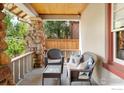 Comfortable front porch setup with wicker seating, perfect for relaxing outdoors at 721 9Th St, Boulder, CO 80302