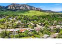 Scenic aerial view of a residential area with lush greenery and stunning mountain backdrop at 1350 Lehigh St, Boulder, CO 80305