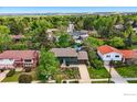 Aerial shot of a charming home with a landscaped yard, nestled in a lush, green neighborhood at 1350 Lehigh St, Boulder, CO 80305