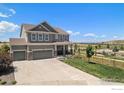 Spacious two-story home with a large driveway and well-manicured front yard at 17101 Pecos St, Broomfield, CO 80023