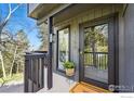 Inviting front entrance with covered porch and stylish details at 1750 Deer Trail Rd, Boulder, CO 80302