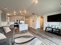 Bright living room with stainless steel appliances at 401 Bonneville Ave, Fort Lupton, CO 80621