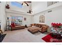 Inviting living room with vaulted ceilings, lots of natural light, and decorative details at 4056 Perth St, Denver, CO 80249