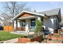 Charming single-Gathering home with a well-maintained front yard, garden boxes, and covered porch at 4401 Vrain St, Denver, CO 80212