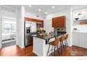 Bright kitchen with stainless steel appliances, a dark countertop island, and barstool seating at 4555 13Th St # 2C, Boulder, CO 80304