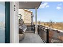Cozy front porch features a relaxing porch swing and serene outdoor views at 47 N Uriah St, Aurora, CO 80018