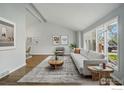 Bright living room with vaulted ceilings, large windows and wood flooring at 4961 W 98Th Ave, Westminster, CO 80031
