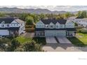 Aerial view of townhome community surrounded by lush greenery and scenic mountain views at 919 Russell St, Golden, CO 80401