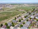 Neighborhood aerial view showing the home's location near green spaces and walking trails at 10553 Joplin St, Commerce City, CO 80022