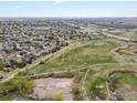 Expansive aerial view showcasing the neighborhood's proximity to open space and walking paths at 10553 Joplin St, Commerce City, CO 80022