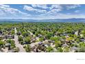 Expansive aerial view showcasing the neighborhood's lush greenery and mountain backdrop at 1407 S Terry St, Longmont, CO 80501