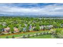 Panoramic aerial view of the property showcasing the neighborhood, surrounding landscape, and mountain views at 1724 Holeman Dr, Erie, CO 80516