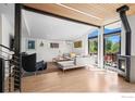 Spacious living area with a modern fireplace, comfortable seating, and large windows for natural light at 2725 6Th St, Boulder, CO 80304