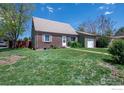 Charming single-story home with brick facade, well-manicured lawn and attached garage, ideal for Gathering living at 2951 W 73Rd Ave, Westminster, CO 80030