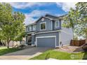 Charming two-story home with a well-maintained front yard and a two car garage at 4005 Frederick Cir, Longmont, CO 80503