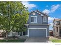 Charming two-story home with a well-maintained front yard, and a two car garage at 4005 Frederick Cir, Longmont, CO 80503