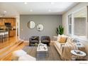 Inviting living room with hardwood floors, modern decor, and an open layout to the kitchen at 4760 Lee Cir, Boulder, CO 80303