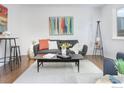Inviting living room with a modern sofa, sleek coffee table, and stylish decor at 713 Arrow Ct, Lafayette, CO 80026