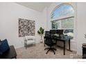 Bright office with a large arched window providing lots of natural light at 810 Trail Ridge Dr, Louisville, CO 80027