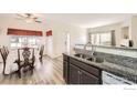 Cozy kitchen featuring granite countertops and stainless double basin sink at 1148 Opal St # 101, Broomfield, CO 80020