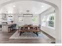 Open dining room area featuring modern light fixture and natural light at 1304 9Th Ave, Longmont, CO 80501