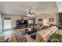 Cozy living room with nice furnishings, hardwood floors, and plenty of natural light at 13642 Wrangler Way, Mead, CO 80542