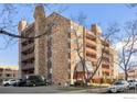 Multi-story condominium building showing beautiful brickwork and private balconies accessible from each unit at 252 N Pennsylvania N St # 305, Denver, CO 80203