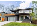 Modern home showcases sleek architecture, a two-car garage, and a charming front porch at 2595 Glenwood Dr, Boulder, CO 80304