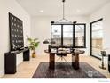 Modern office space with a sleek desk, statement art, and large windows at 633 Dexter St, Denver, CO 80220
