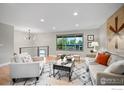 Cozy living room with large windows, comfortable seating, and modern decor at 794 W Elati W Cir, Littleton, CO 80120