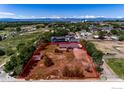 A single-Gathering home situated on a large lot in a residential area with mountain views at 10007 E County Line Rd, Longmont, CO 80501