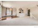Spacious living room with hardwood floors, carpet and neutral paint perfect for relaxation at 1085 Malory St, Lafayette, CO 80026