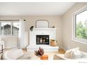 Bright living room featuring a white brick fireplace and modern decor at 1560 Kendall Dr, Boulder, CO 80305