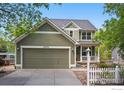 Two-story home featuring an attached garage and well-manicured landscaping at 3093 Red Deer Trl, Lafayette, CO 80026