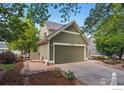 View of a home with attached garage and landscaping at 3093 Red Deer Trl, Lafayette, CO 80026