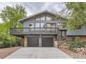 Two-story home with a two-car garage and elevated balcony at 3410 Heidelberg Dr, Boulder, CO 80305