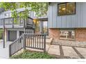 Front entrance featuring a modern door, gray trim, and stone pathway at 3410 Heidelberg Dr, Boulder, CO 80305