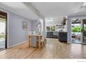 Bright dining area with hardwood floors, skylight, and a view to the backyard at 3582 Smuggler Way, Boulder, CO 80305