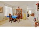 Bright dining room featuring a classic hutch and carpet, perfect for Gathering gatherings at 4312 Windmill Dr, Brighton, CO 80601