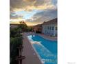 Community pool and spa area offers a serene outdoor retreat and sunset views at 457 Black Feather Loop # 704, Castle Rock, CO 80104
