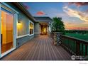 Large deck with wood floors and views of the open landscape at 4648 Belford Cir, Broomfield, CO 80023