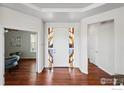 Inviting entryway features a stylish front door with decorative stained glass sidelights at 4648 Belford Cir, Broomfield, CO 80023