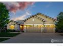 Beautiful home with a spacious three-car garage and well-maintained lawn at 4648 Belford Cir, Broomfield, CO 80023