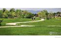 Scenic community park with walking paths, green space, and mountain views at 4860 W 125Th Ave, Broomfield, CO 80020