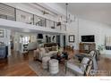 Bright living area featuring hardwood floors, stylish furniture, and an open layout connecting to the kitchen at 7204 Rustic Trl, Boulder, CO 80301